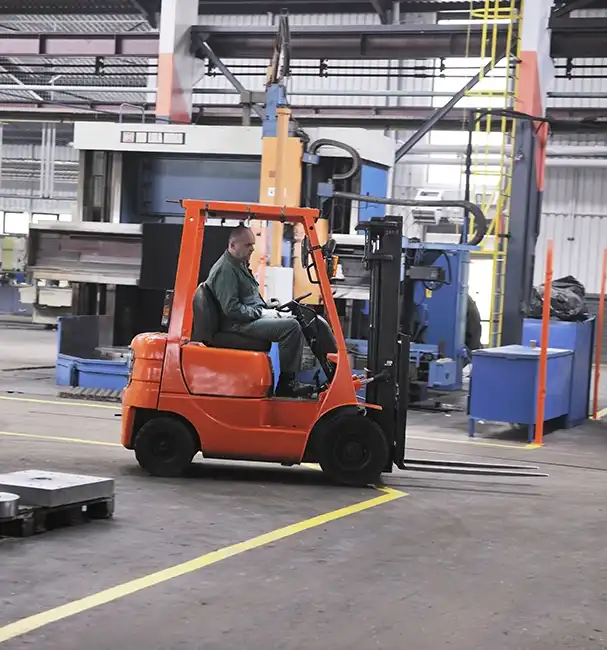 Forklifts & MHE Workforce Management Solutions 4 Forklift in use moving materials in a factory